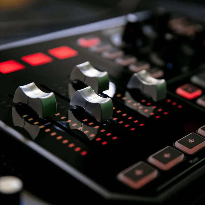 Close-up of GoXLR faders and their level meters.